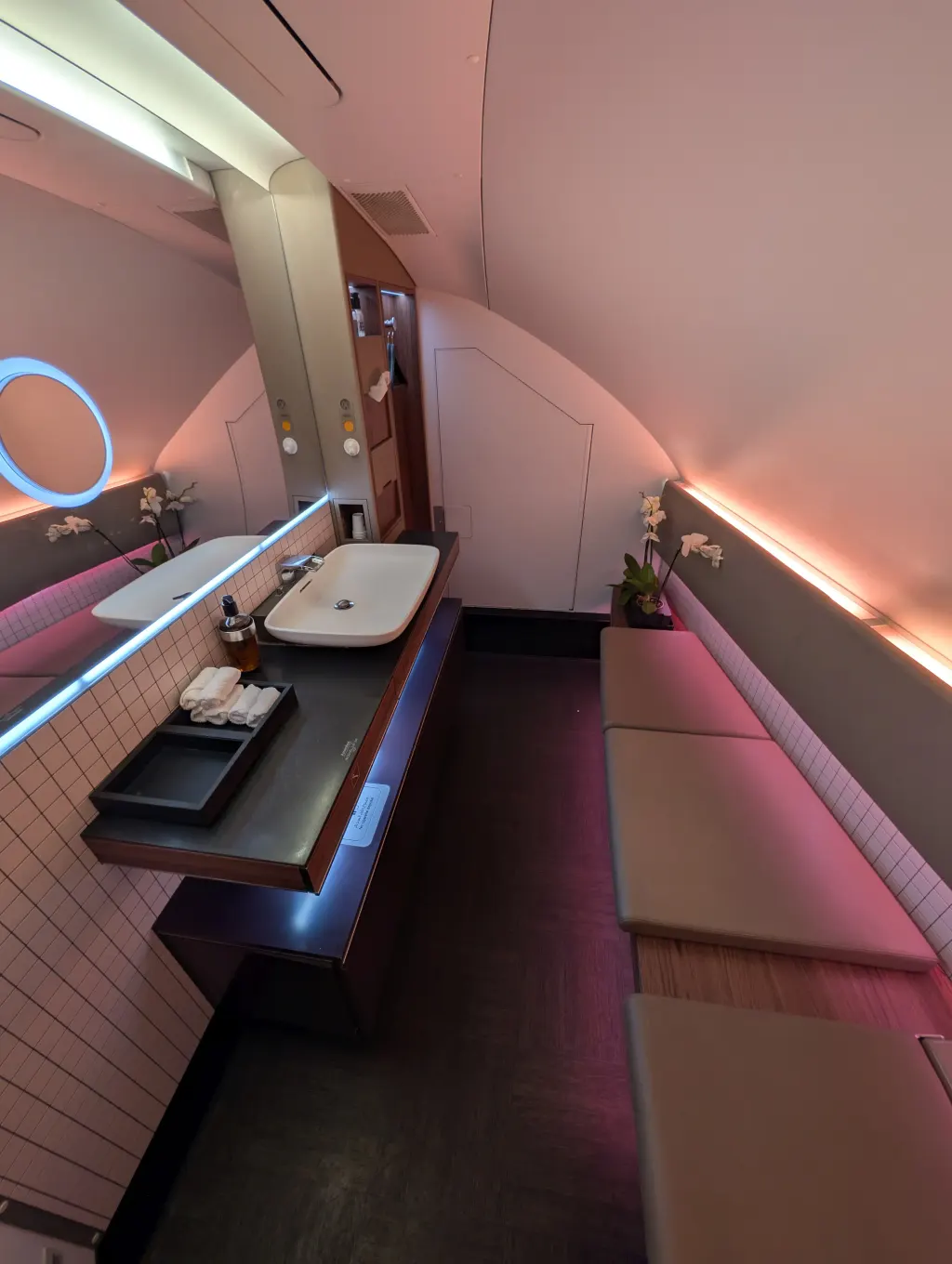 Qatar Airways A380 First Class lavatory powder room with orchid