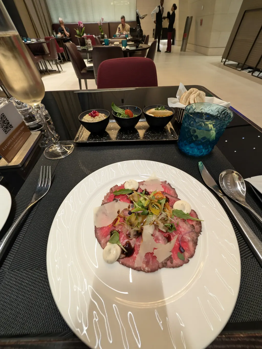 Beef carpaccio and mezze dish at the Al Safwa First Class Lounge restaurant