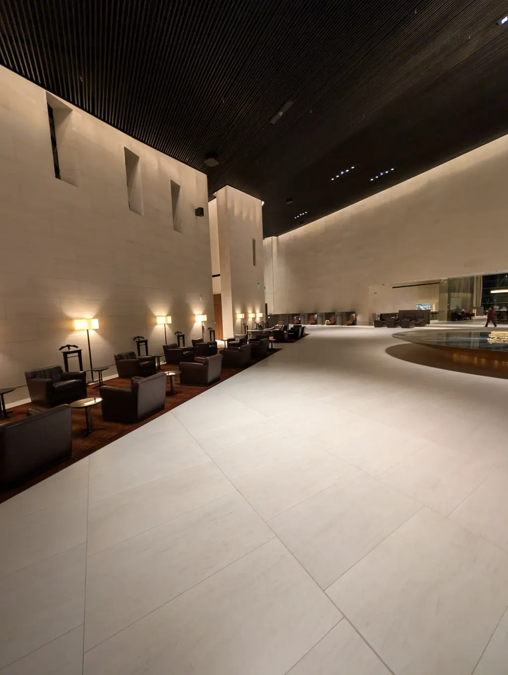 Al Safwa First Class Lounge seating along the central walkway at Doha Hamad Airport