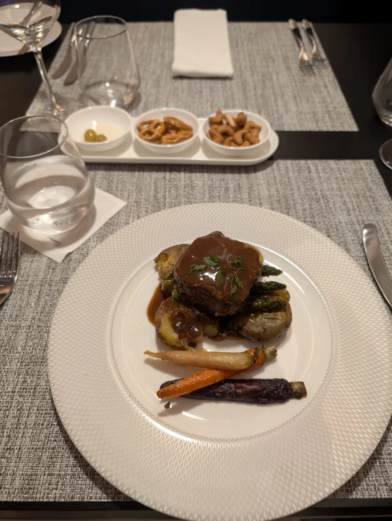 Herb-crusted beef tenderloin with jus, crushed potatoes and heritage carrots at British Airways Concorde Dining, Changi